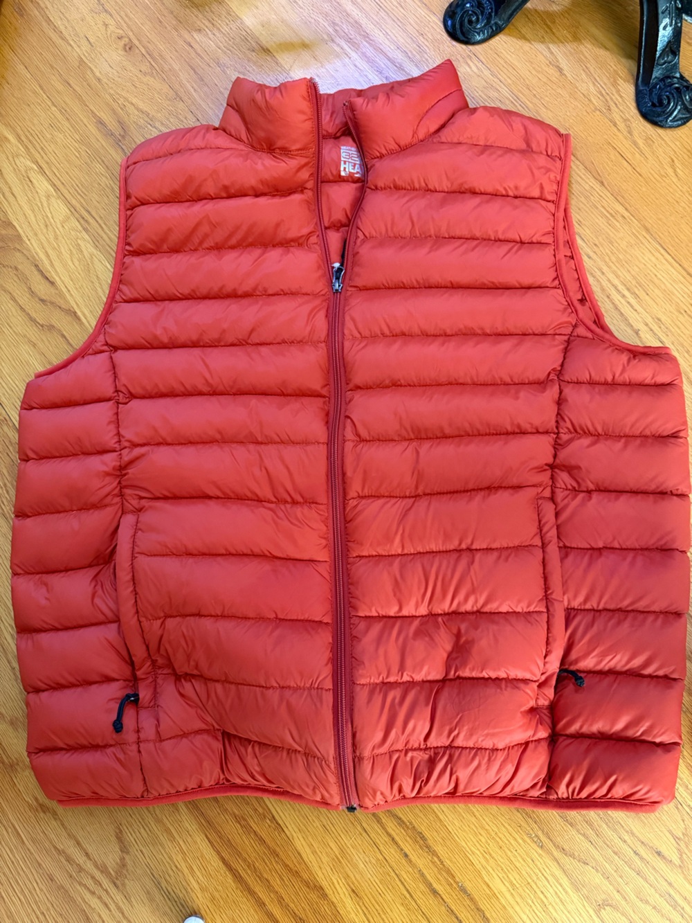 Men’s orange puffer vest